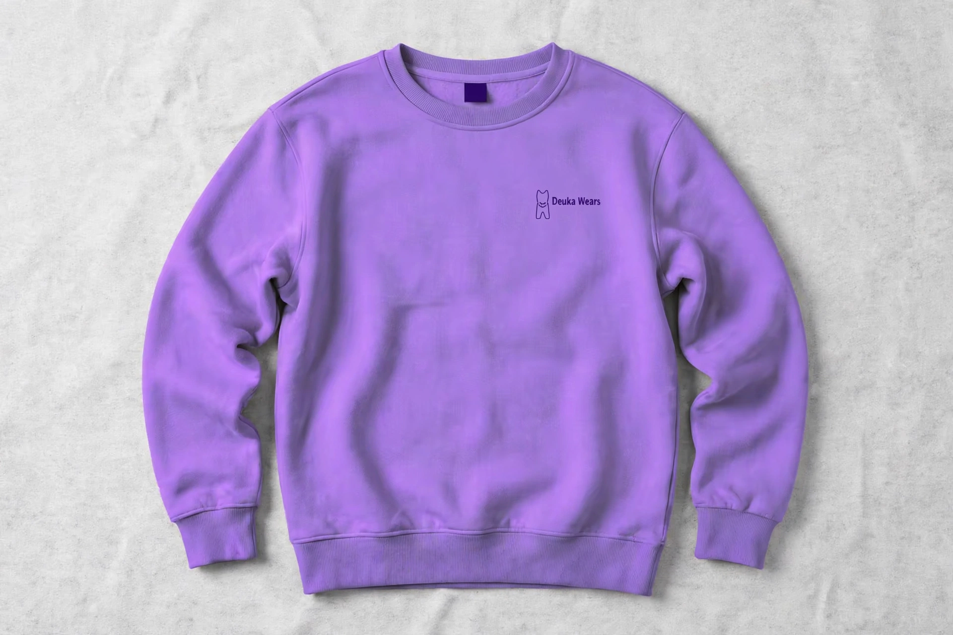 Lavender Deuka Wears crewneck sweatshirt centered in 1920 by 1280 landscape frame, flat lay front view on light grey textured background, no text